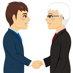 Portrait of two businessmen shaking hands senior young partnership concept
