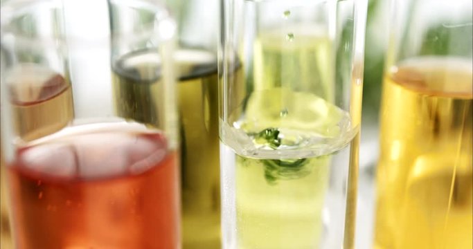 HTML5 Video is required for viewing the video 	acid hair and skin research scientist macro views of microscopic particles in a liquid for the analysis of beauty and cosmetics and scientific laboratori