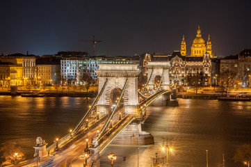 Night View of the Szechenyi Chain Bridge and church St. Stephen's in Budapest