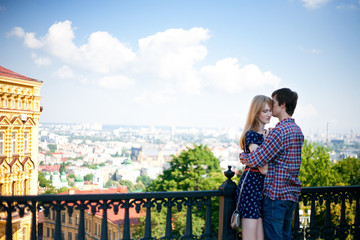 Naklejka premium Young couple in love, hugging on the street
