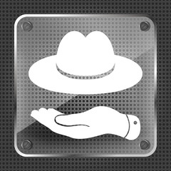 flat hand showing black hat icon on a metallic background