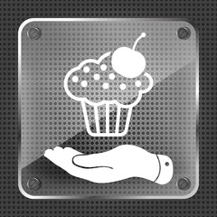 Glass hand presenting black cake icon with cherry on a metallic