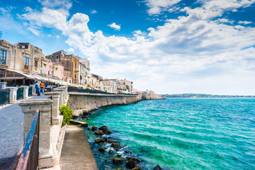 Coast of Ortigia island at city of Syracuse, Sicily, Italy. Beautiful travel photo of Sicily. - obrazy, fototapety, plakaty