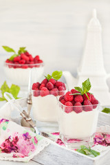 Delicious sweet  mousse decorated with fresh raspberries