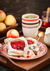 Delicious berry puff pastry with powdered sugar and coffee
