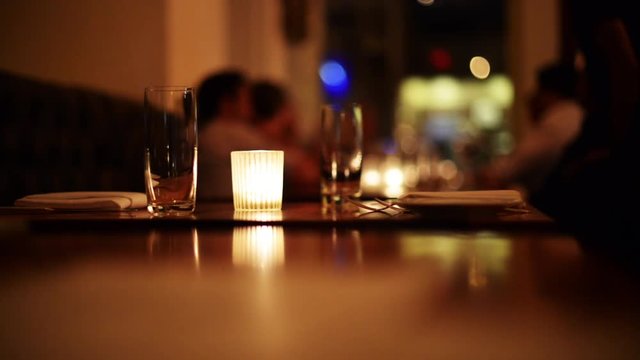 Romantic candlelight dinner at restaurant, 