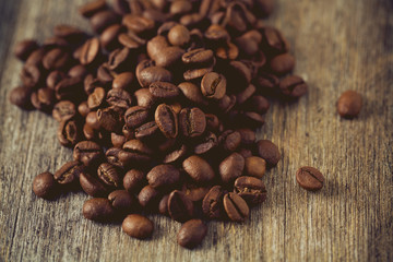 coffee beans on wooden surface