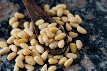 pine nuts on granite surface