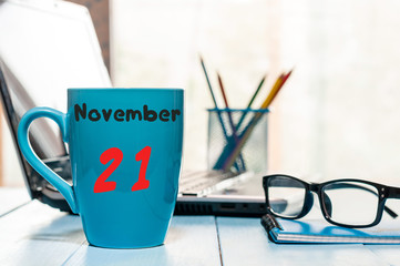 November 21st. Day 21 of month, morning drink cup with calendar on Database Administrator workplace background. Autumn time. Empty space for text