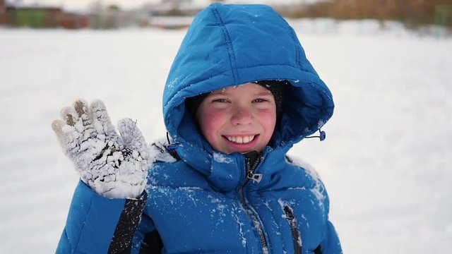 child standing and sweet smiling in winter time.