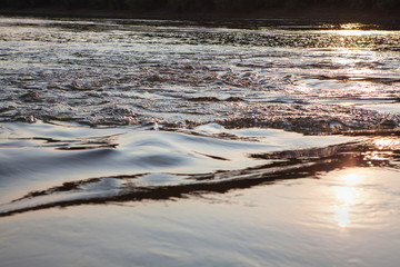 sun reflection in flowing water