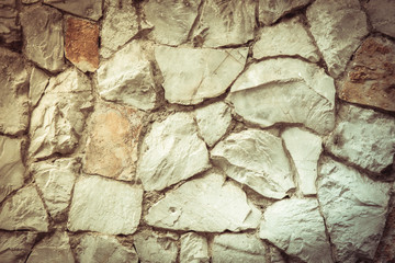 Texture old rock wall made of random stone