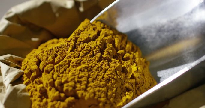 Super slow motion macro of cumin powder dosage (close up)