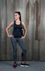 attractive woman with jumping rope against rustic background