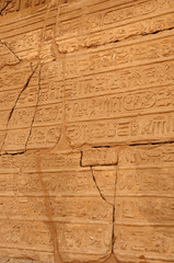 Ancient Egypt. The wall are decorated with carved hieroglyphs. Karnak Temple. Luxor. Thebes.