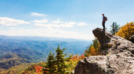 Man walking on the edge of a cliff