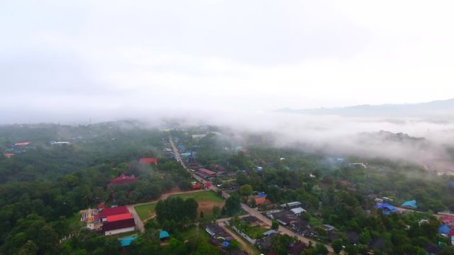 Aerial view of Sangkhlaburi, Kanchanaburi of Thailand, fog floating on the river in the early morning