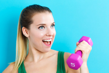 Woman working out with dumbbell