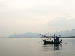Fishing boat floating at shore