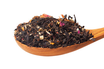 Fototapeta premium Close up of dry tea in wooden spoons.Selective focus on isolated background with clipping path