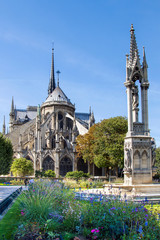 Fototapeta na wymiar Garden at back side of Notre Dame de Paris