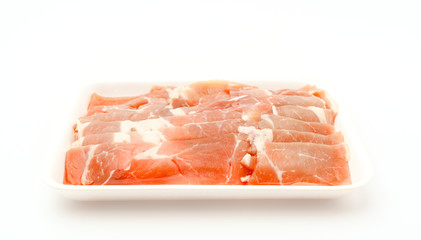 Slide of  raw pork  on white background .