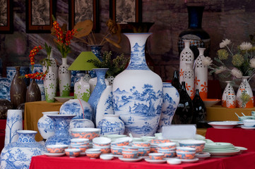 Common traditional pottery products on a shop in Bat Trang ancient ceramic village. Bat Trang village is the oldest and best known pottery village of Vietnam.