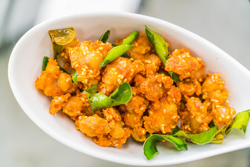 Fried chicken on plate .