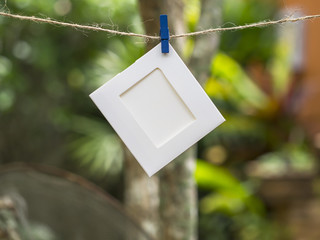 Photo Frames on Rope. background the nature, soft focus