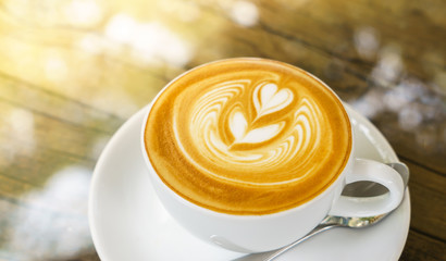 Latte Coffee art on the wooden table