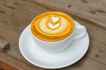 Latte Coffee art on the wooden table