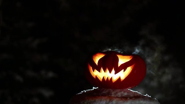 Burning pumpkin on Halloween. Looped