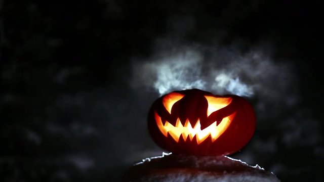 Burning pumpkin on Halloween. Looped