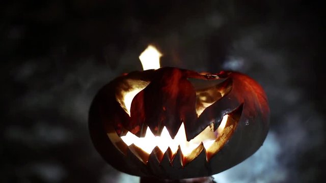 Burning pumpkin on Halloween. Looped