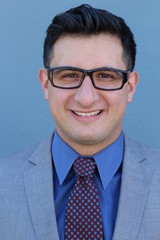 Businessman with glasses smiling and laughing- Stock image