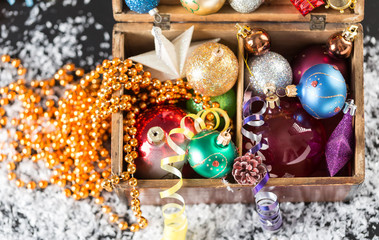 Colorful Christmas balls in a old wooden box