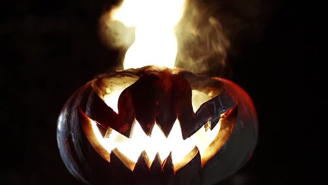 Burning pumpkin on Halloween. Looped