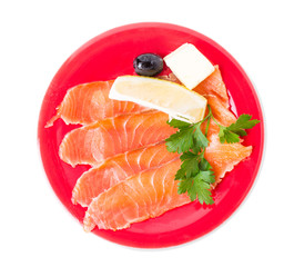 Sliced salmon with lemon and butter.