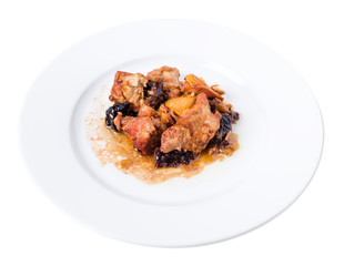Traditional baked pork with dried plums.