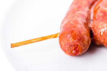 Delicious grilled beef sausage on skewers.