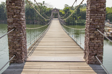 Wooden bridge across the river