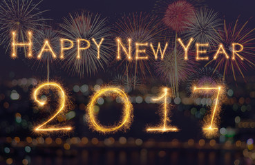 Happy new year 2017 written with Sparkle firework on black backg
