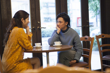 The couple have each other staring at a cafe