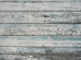Old wooden background from the remains of paint and traces of use