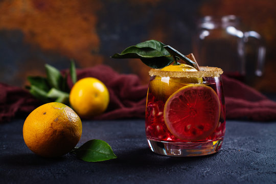 Winter Cocktail With Fruits And Cinnamon