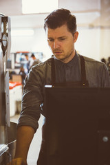 Worker maintain work of coffee roaster