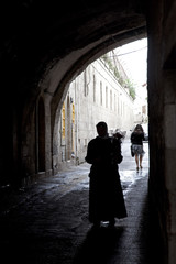 people walking n tunnel