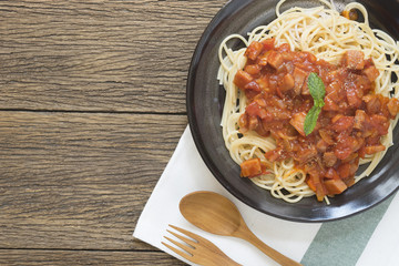serving of Italian spaghetti on wood table