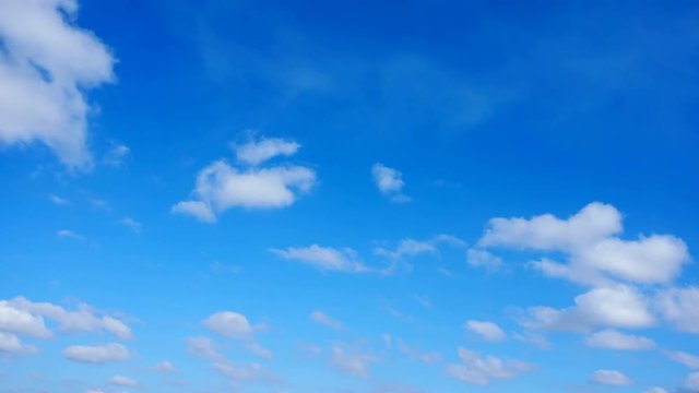 Clouds in the blue sky above the city. Timelapse.
