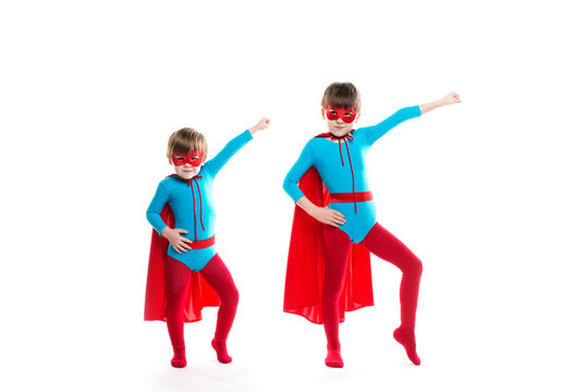 Children dressed as superheroes pose.